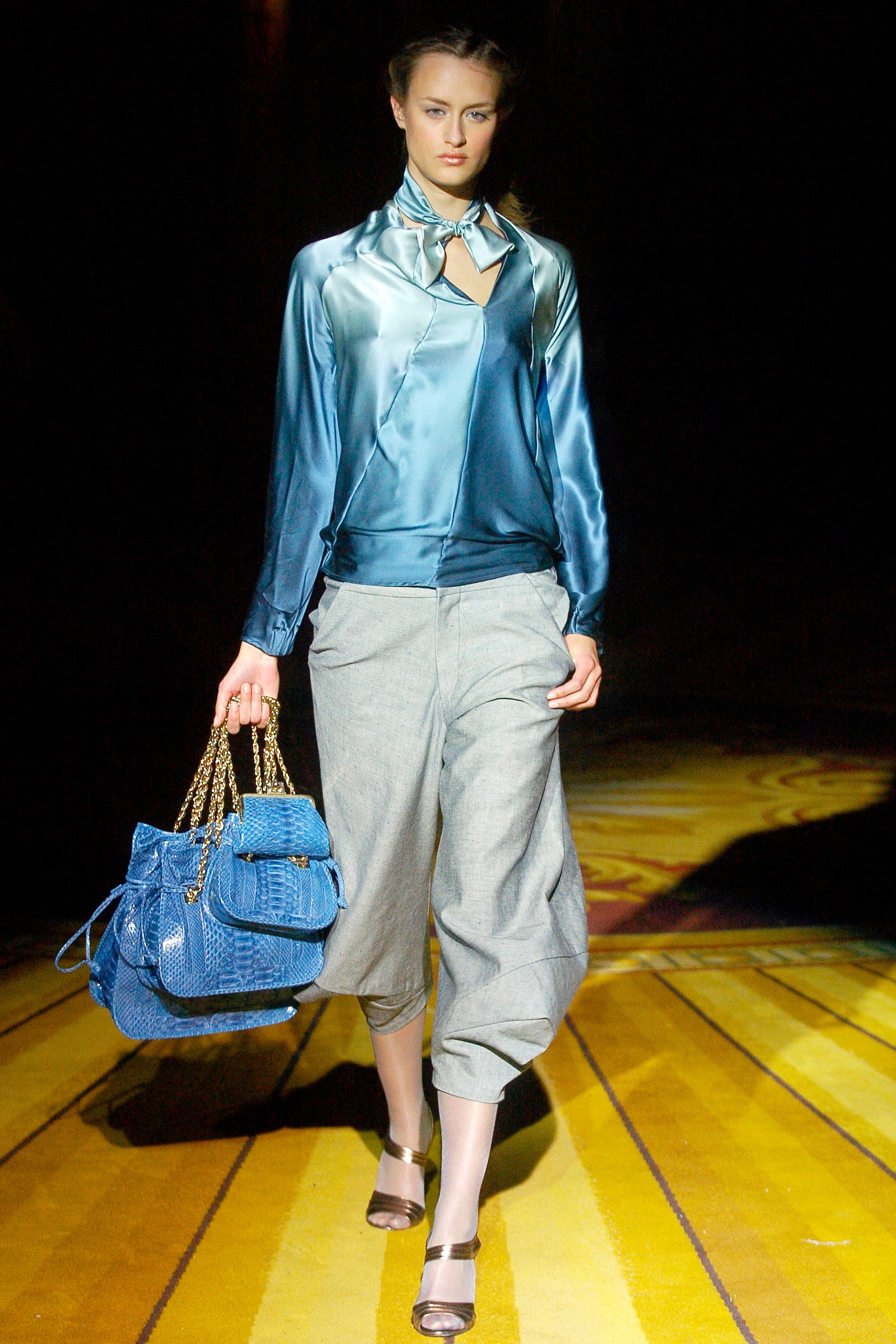 blue silk long-sleeve v-neck fitted draped shiny blouse