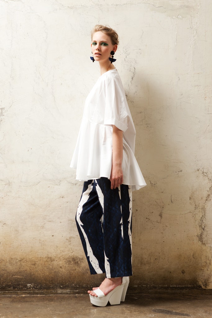 white relaxed top with printed pants