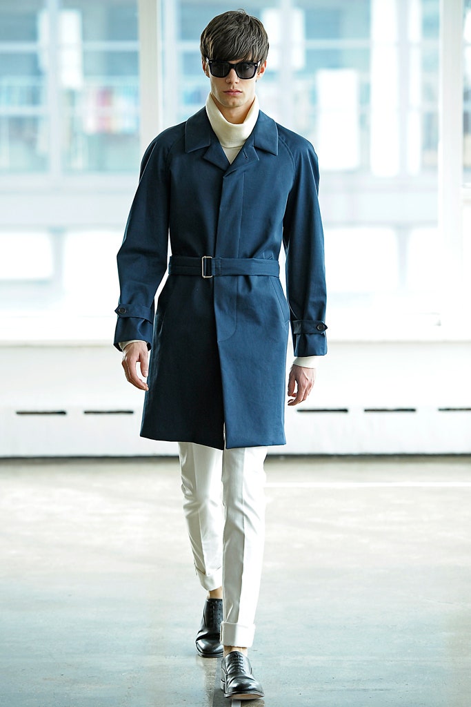 blue tailored coat with white pants