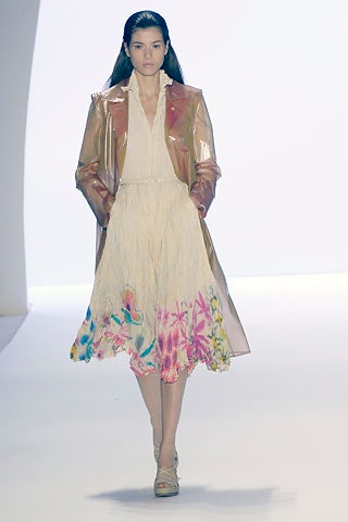 pink vinyl coat and white pleated dress