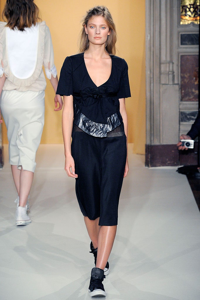 black fitted top with asymmetric skirt