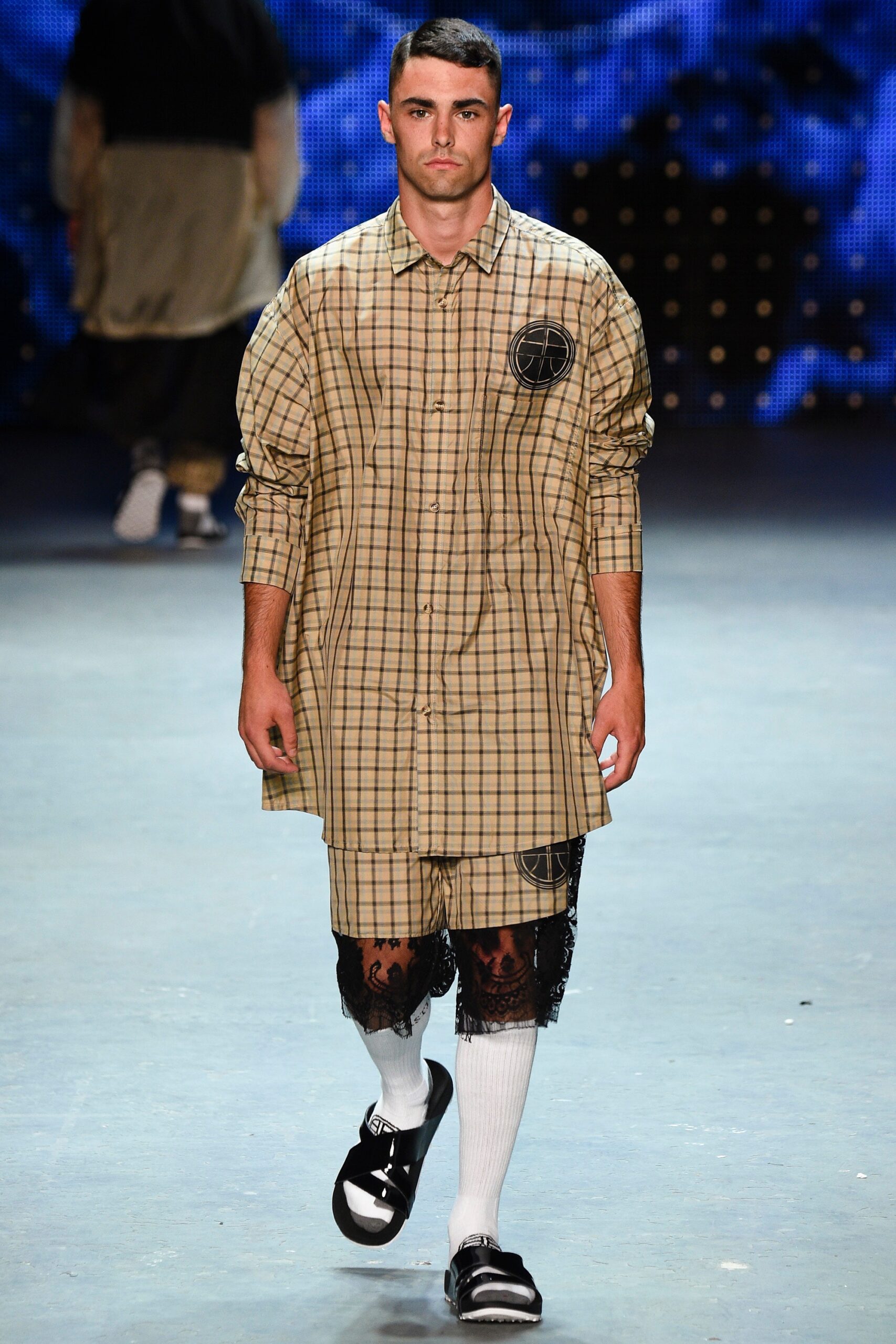 beige checked shirt-dress with black shorts