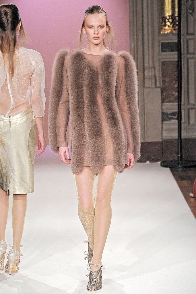 beige fur sleeveless sweater with gold leggings