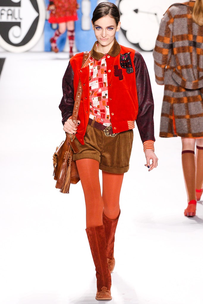 red jacket multi shirt brown shorts