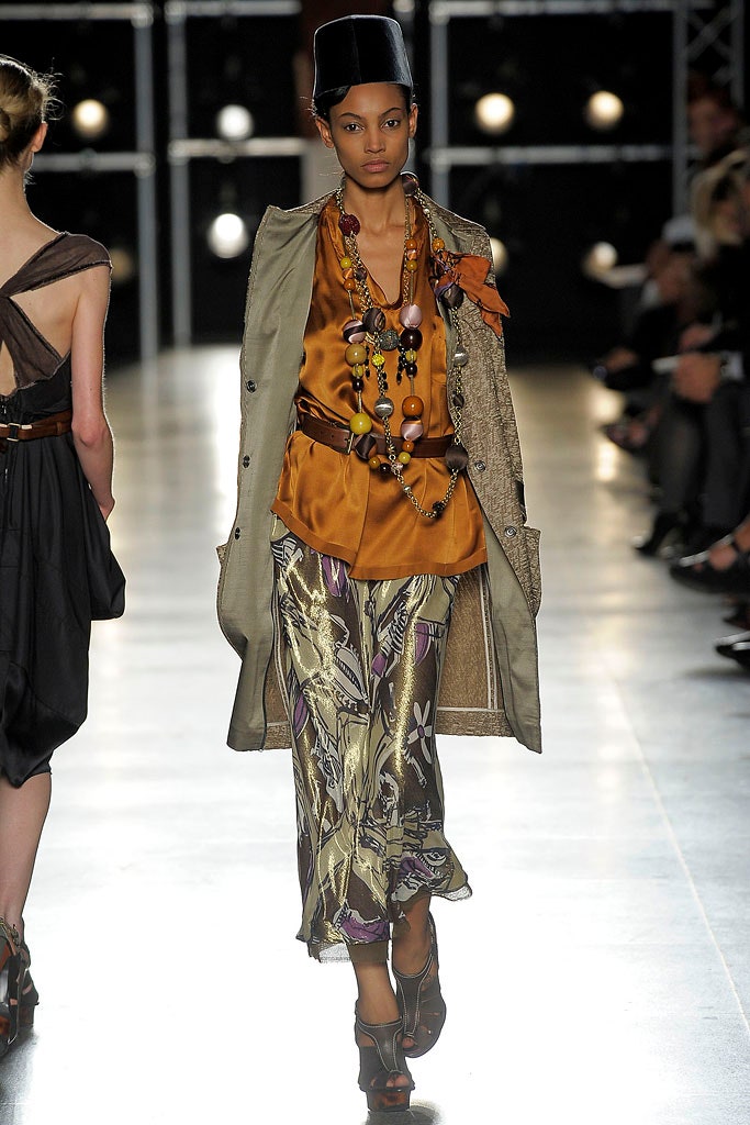 beige coat orange blouse purple skirt