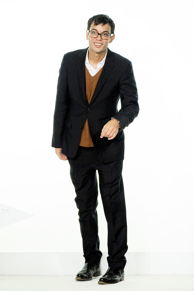 black tailored suit with brown sweater