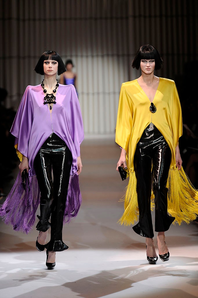 purple and yellow capes with black pants