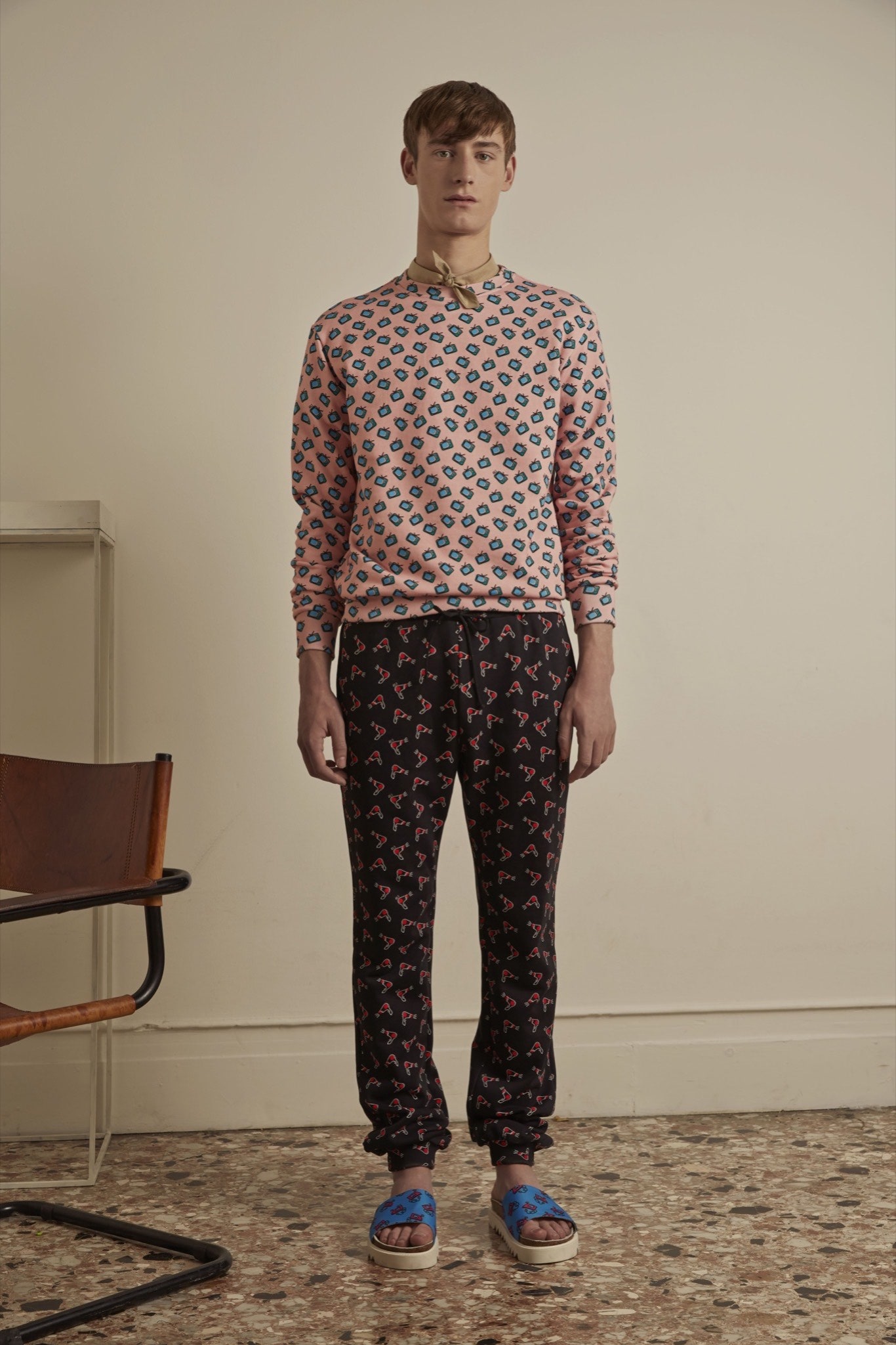 pink printed sweater with black pants