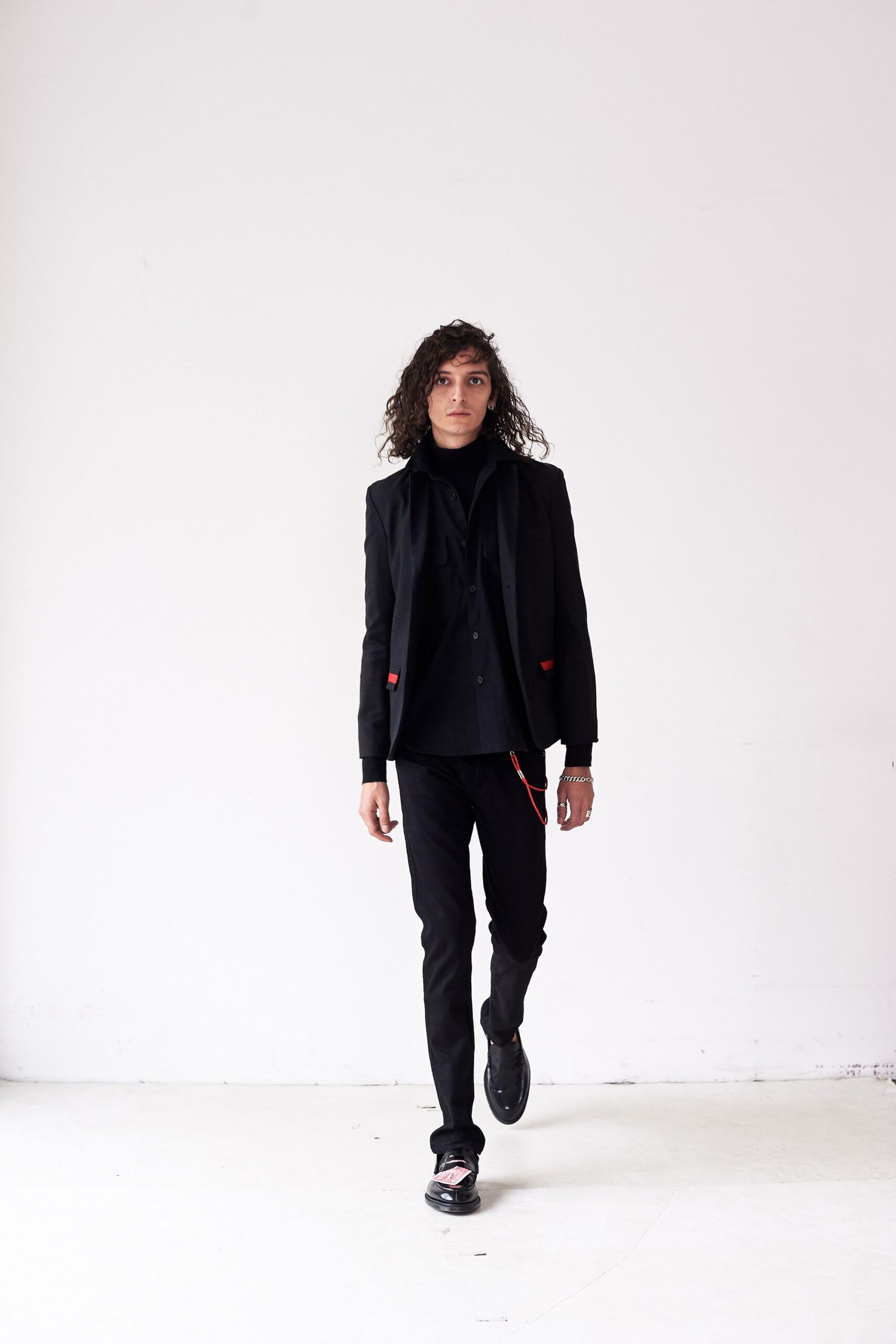 black tailored blazer with slim pants