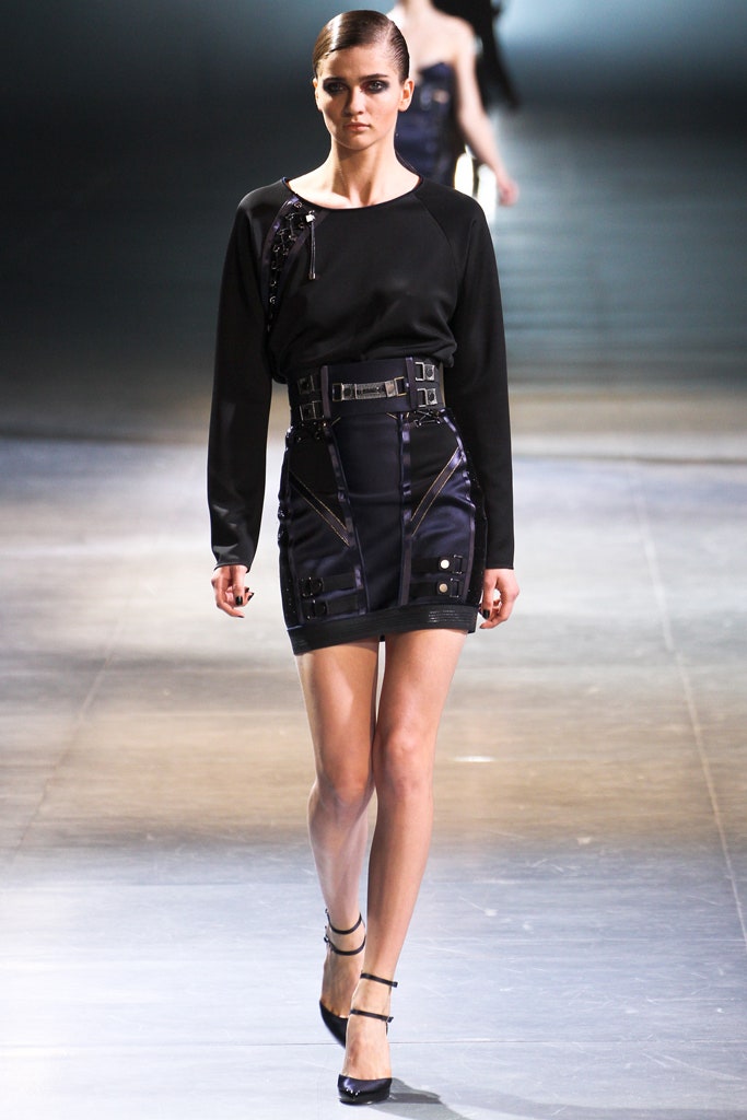 black fitted top and mini skirt