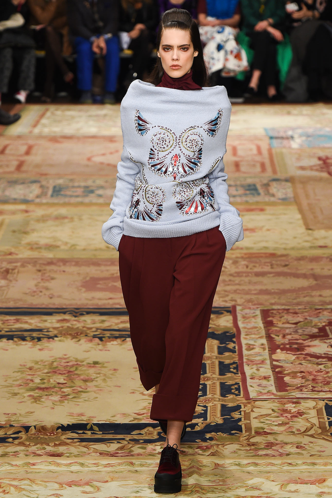 blue embroidered sweater with maroon pants