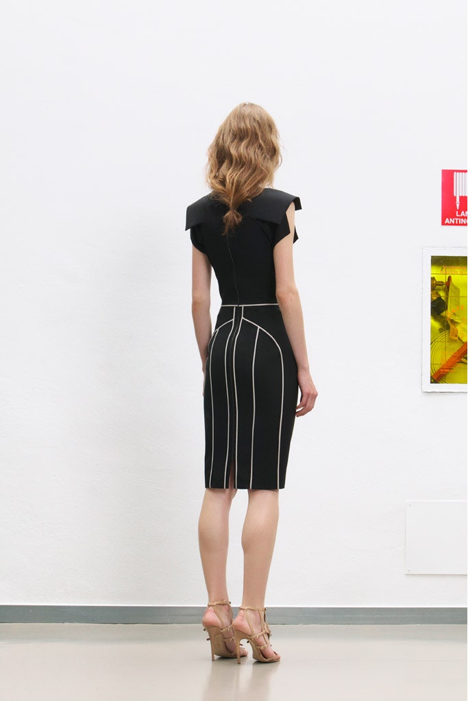 black fitted midi dress with strappy shoes