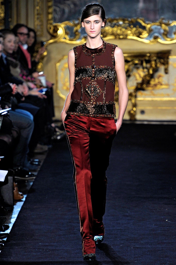 red beaded sleeveless top with velvet pants