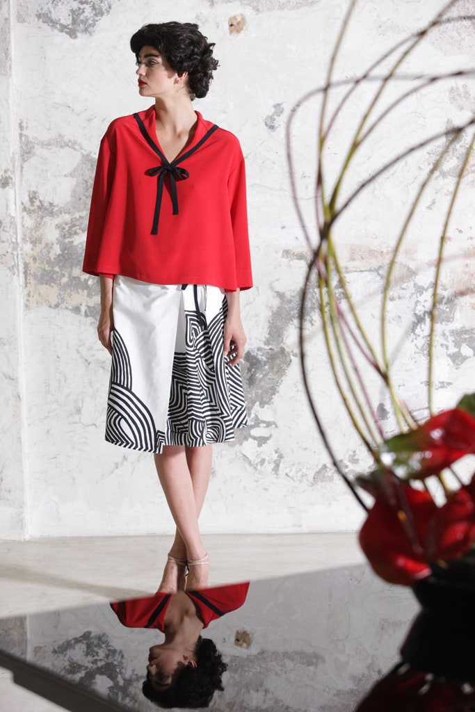 red relaxed top with printed skirt