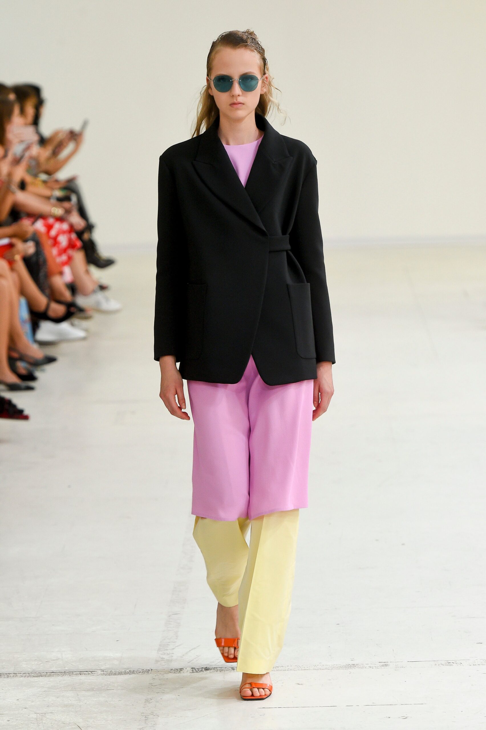black blazer pink top yellow pants