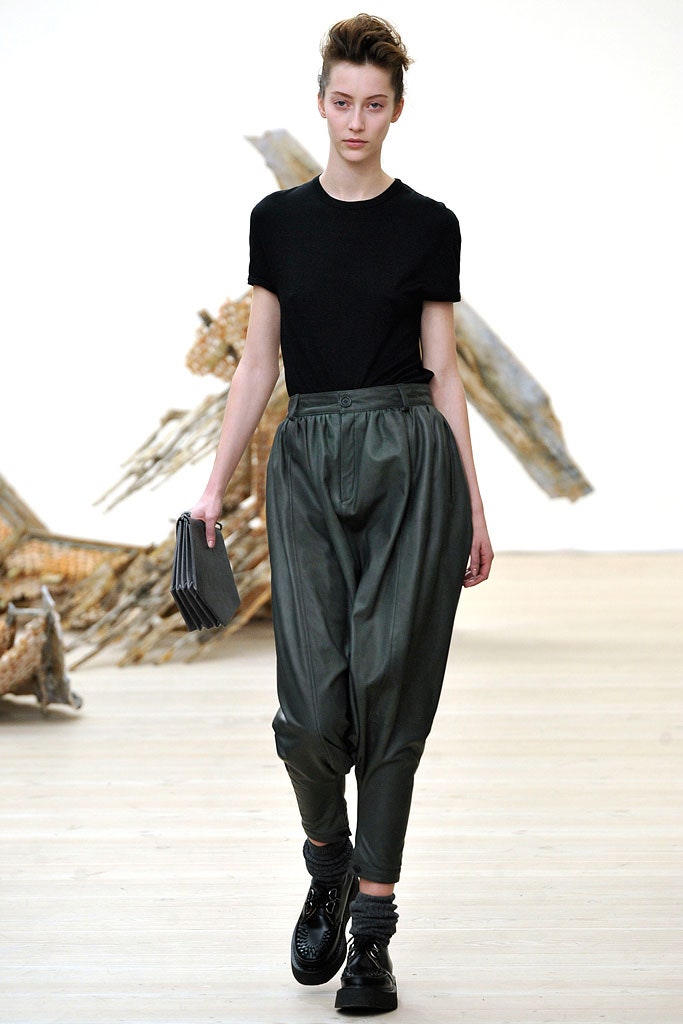 black fitted top with green pants