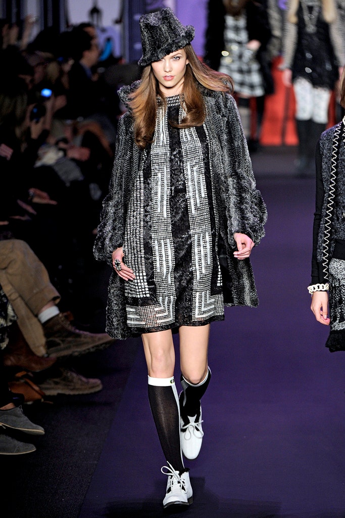 gray faux-fur coat with black dress