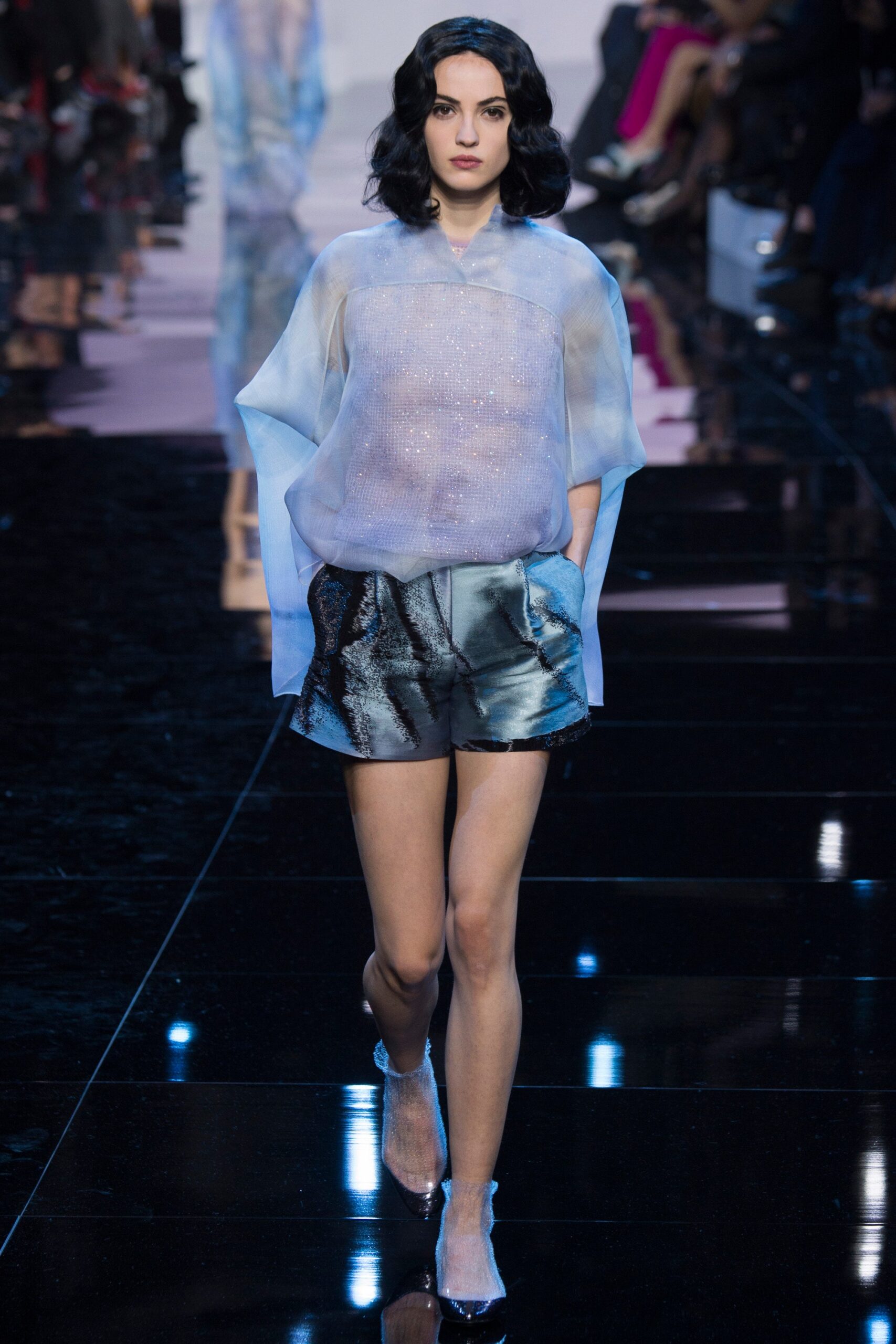 sheer blue top with black shorts