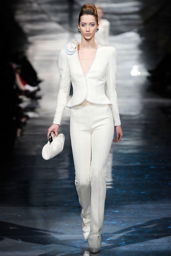 white fitted suit with clutch
