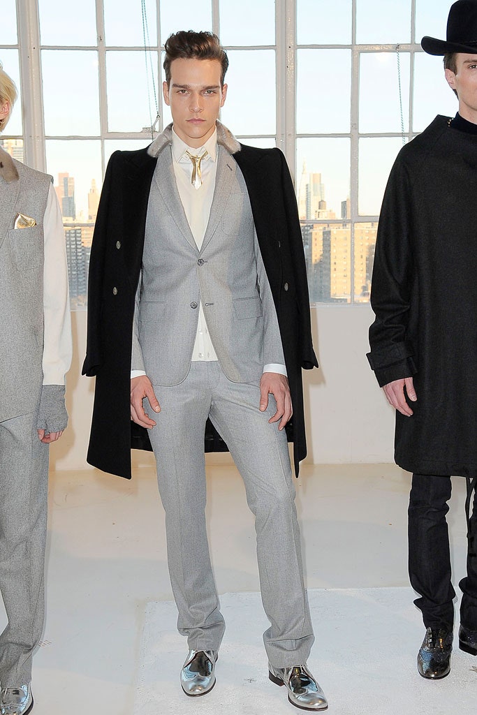 gray tailored suit with black coat