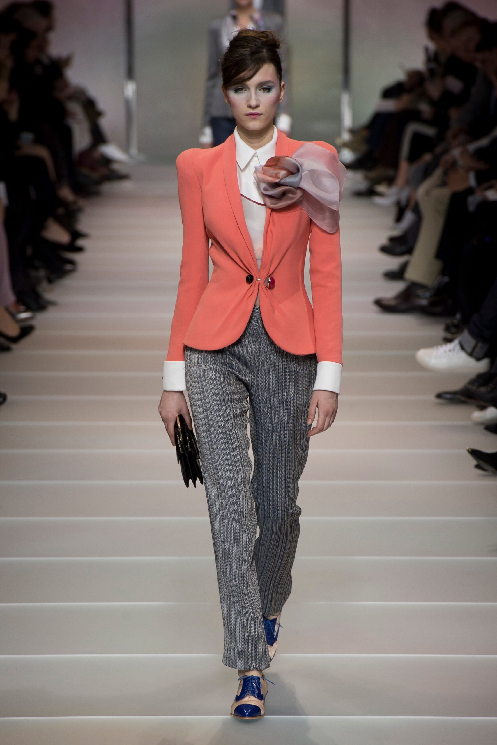 coral tailored blazer with gray striped pants