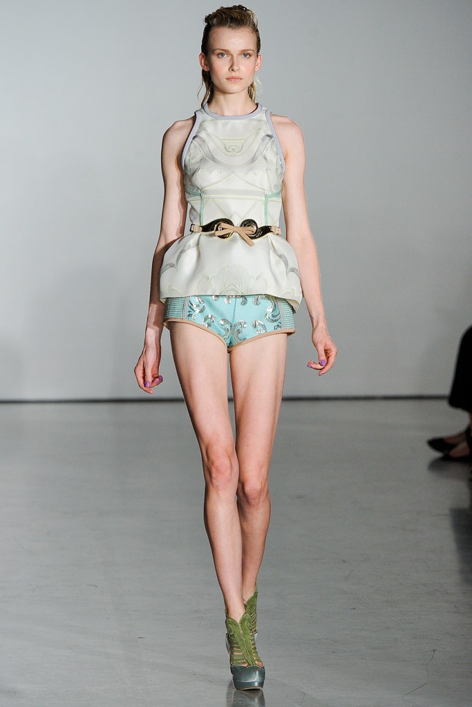white silk fitted top with blue shorts