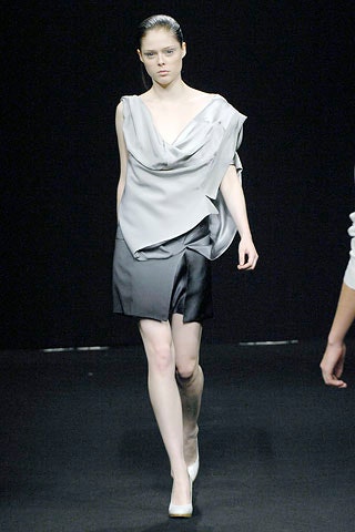 gray draped top with black skirt