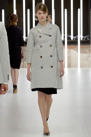 gray fitted coat with black dress