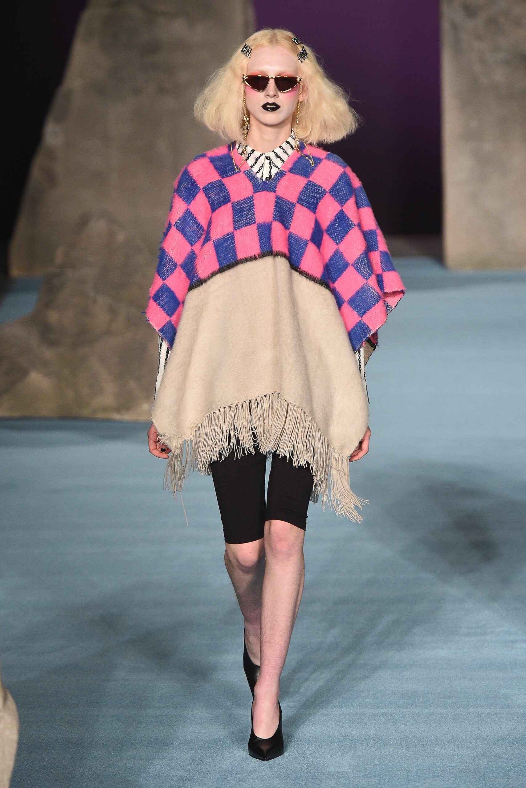 relaxed wool poncho with black shorts