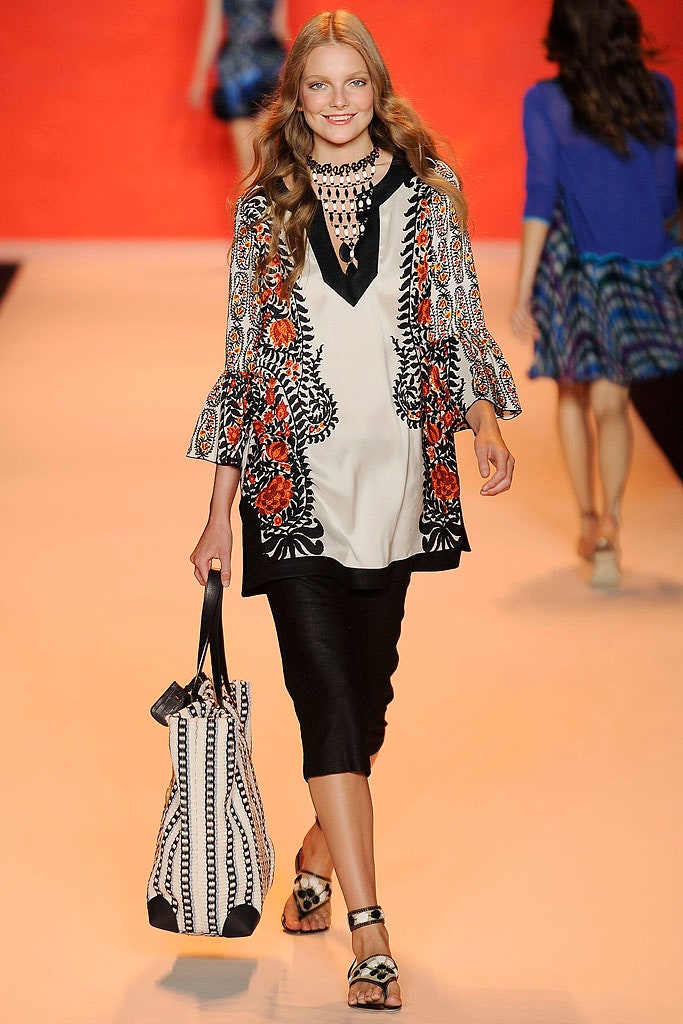 embroidered white top with black skirt