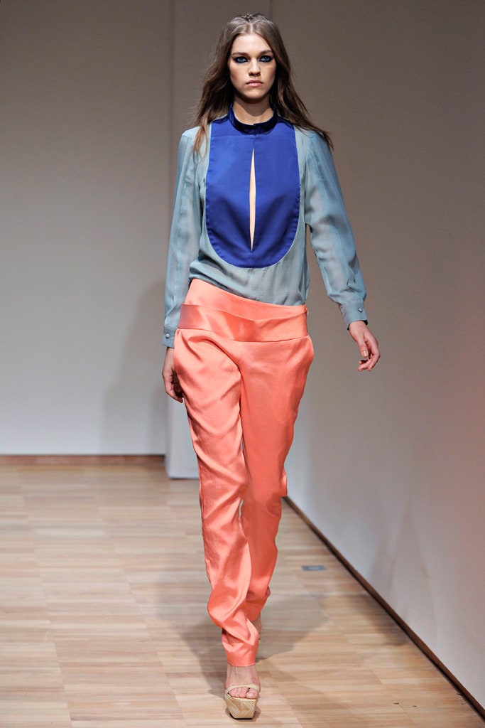 blue silk blouse and orange pants
