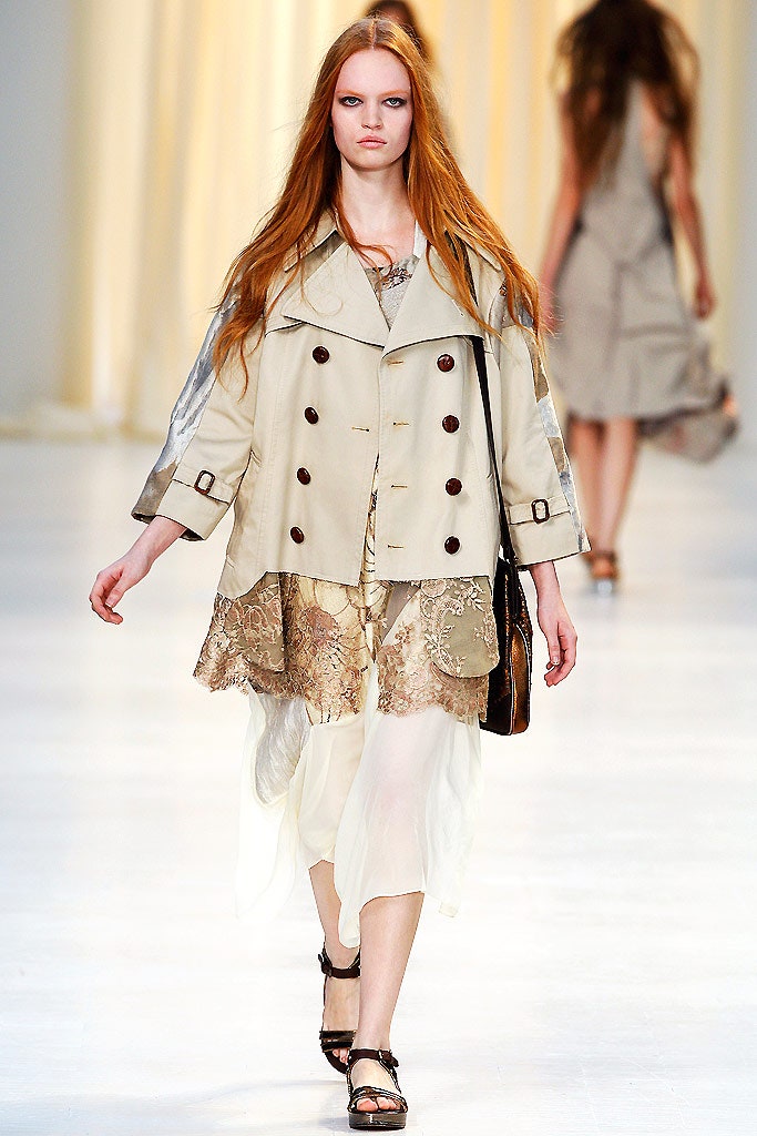 beige trench coat and gold dress