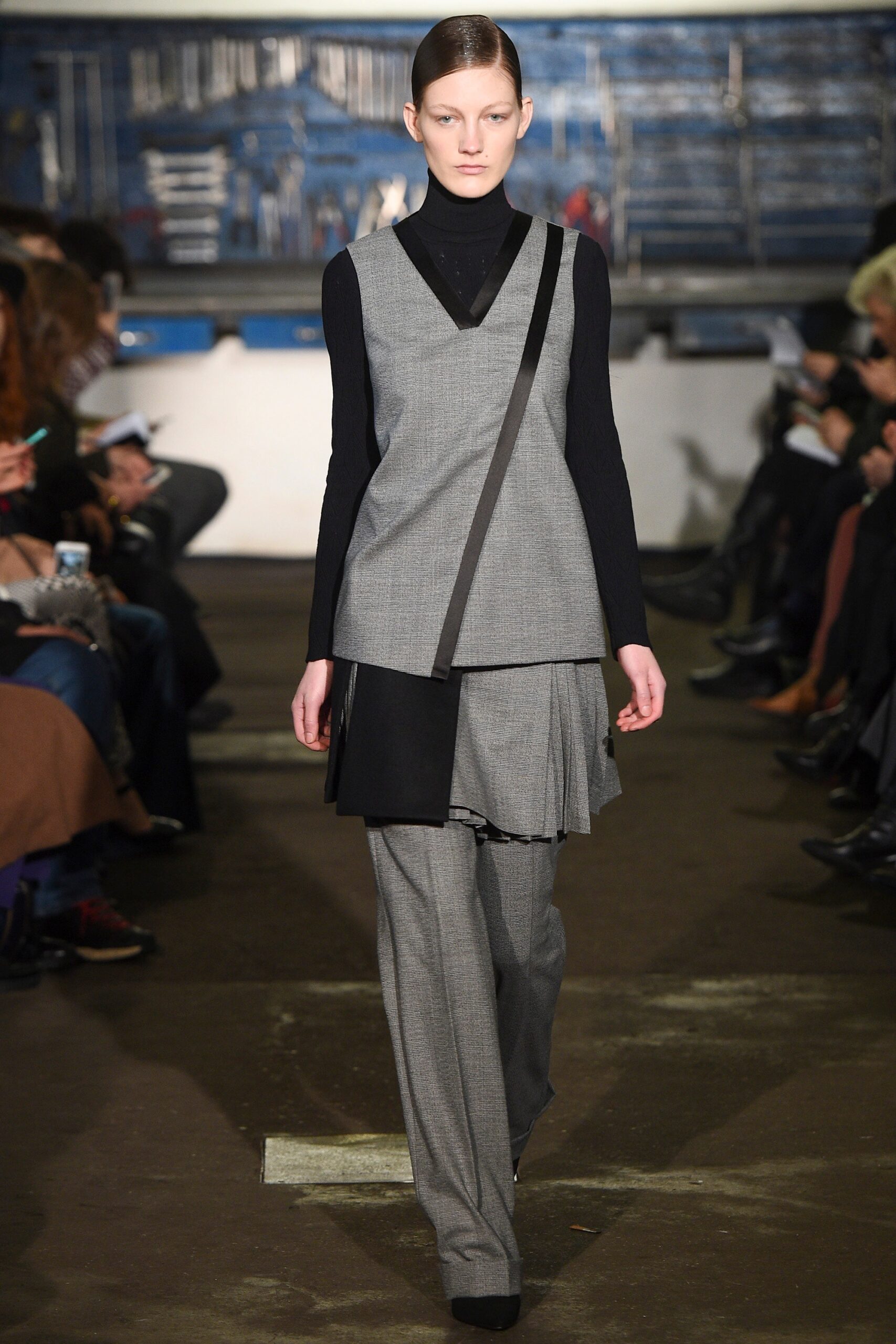 black and gray layered top with tailored pants