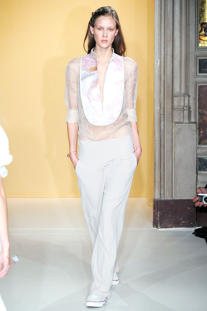 white silk blouse and beige pants