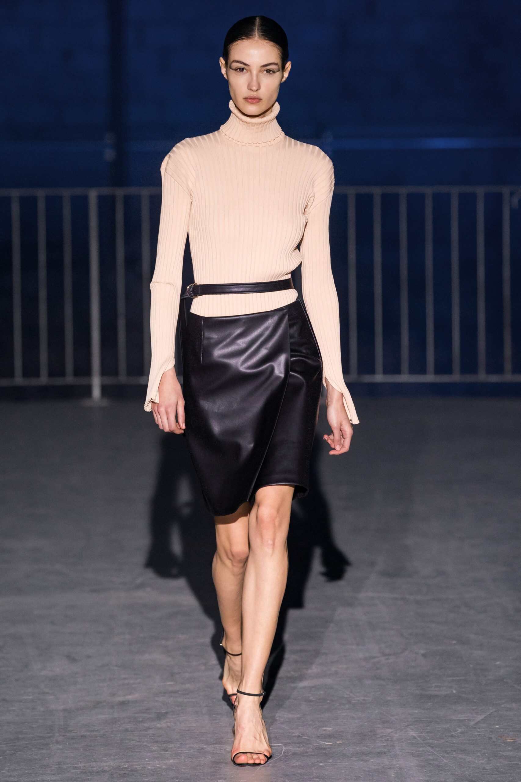 beige fitted turtleneck top and black pencil skirt