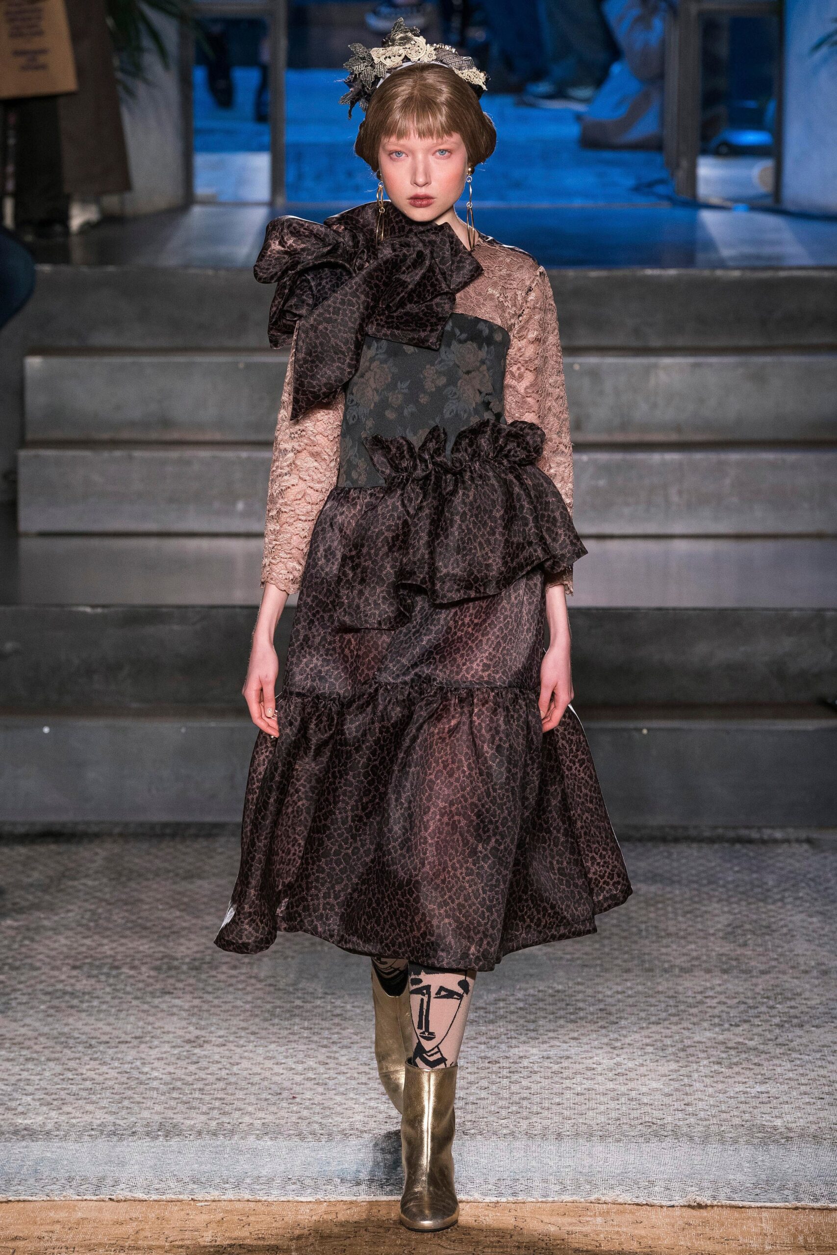black and brown ruffled midi dress with gold shoes