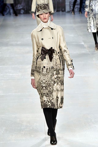 beige printed trench coat and hat
