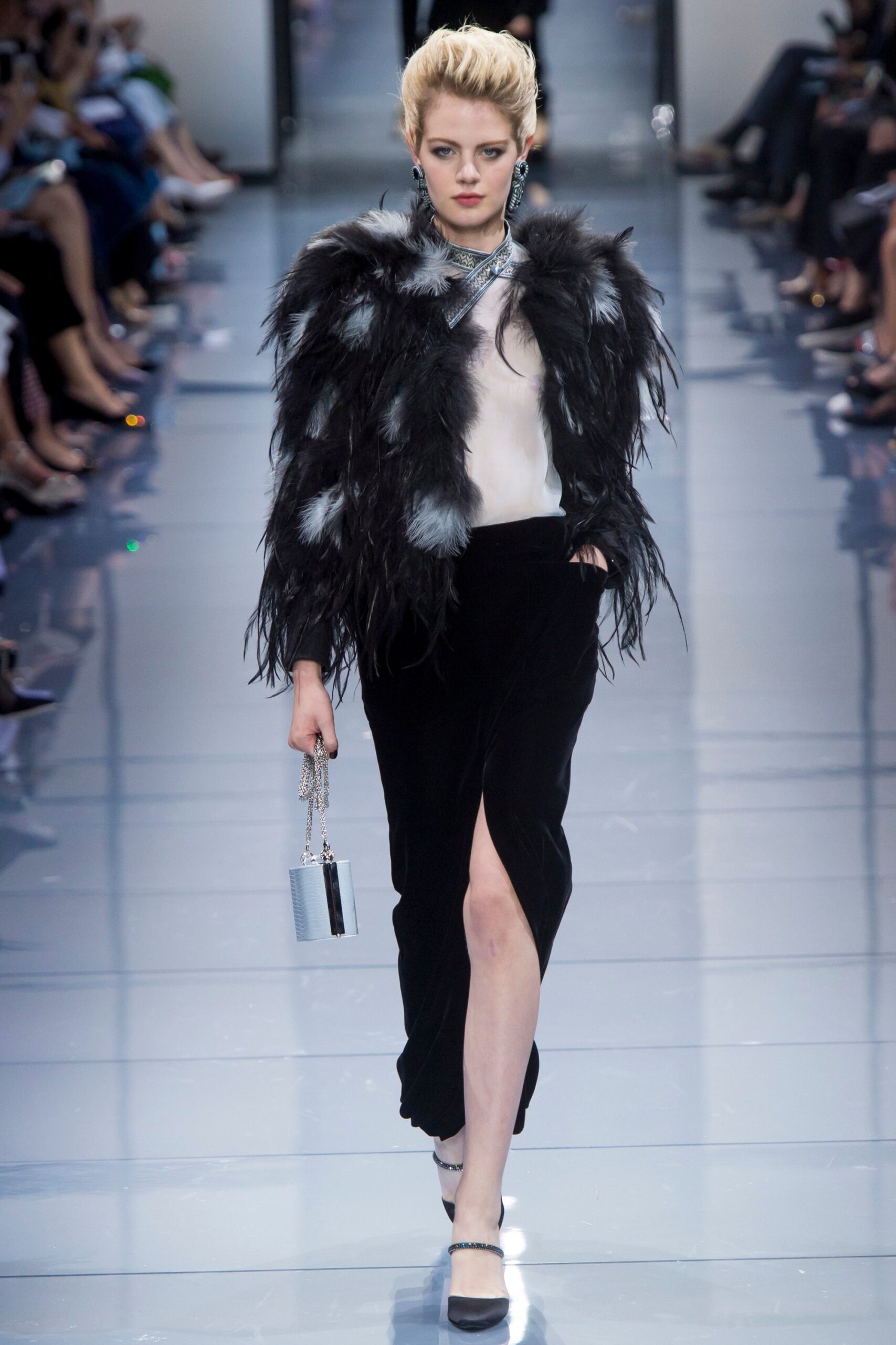 black fur cape with white top