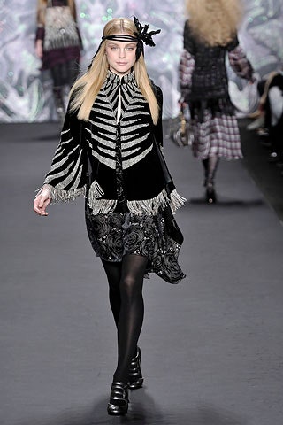 black and white pleated dress with cape