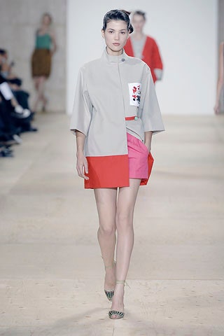 gray collared top with pink skirt