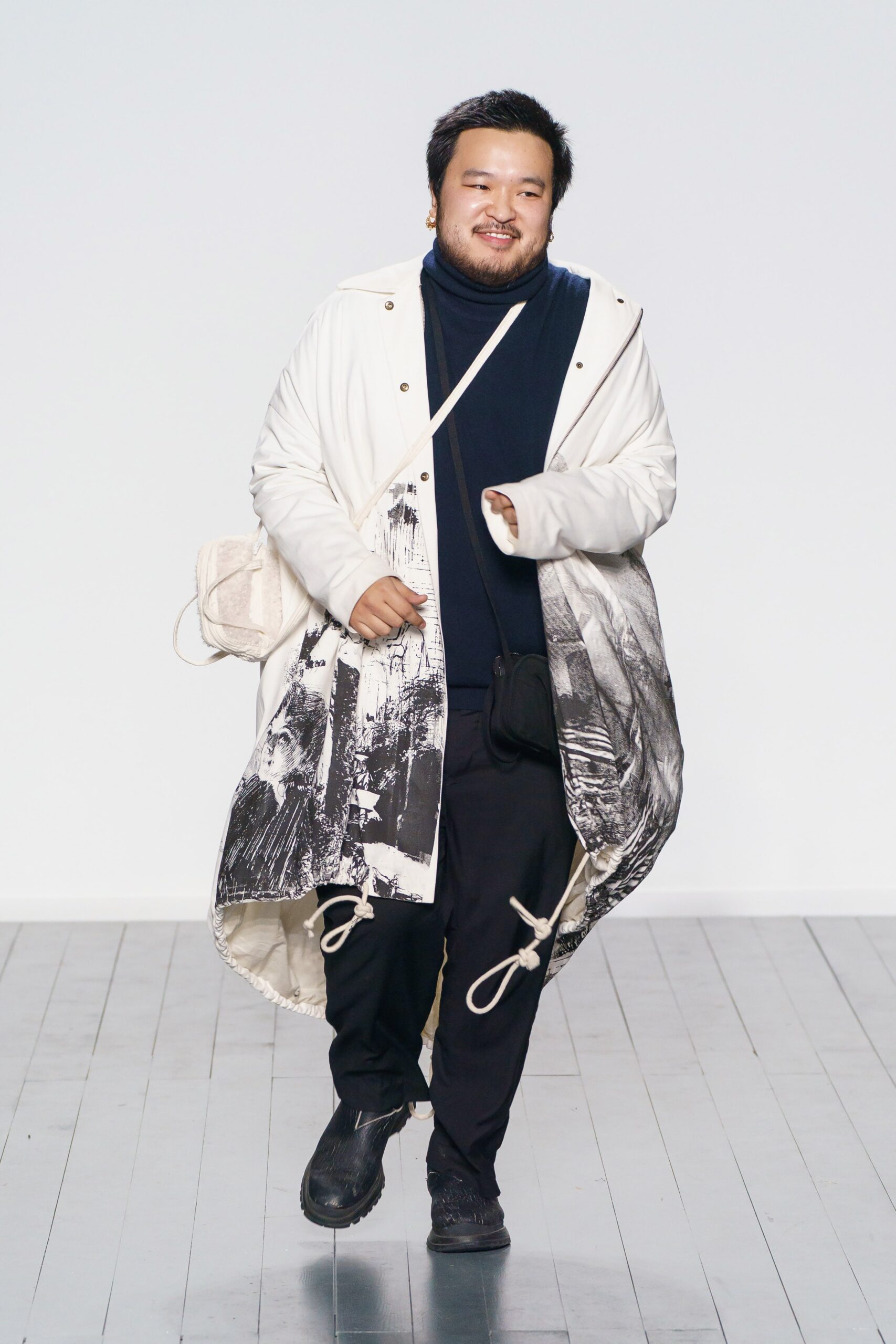 white printed coat with navy turtleneck