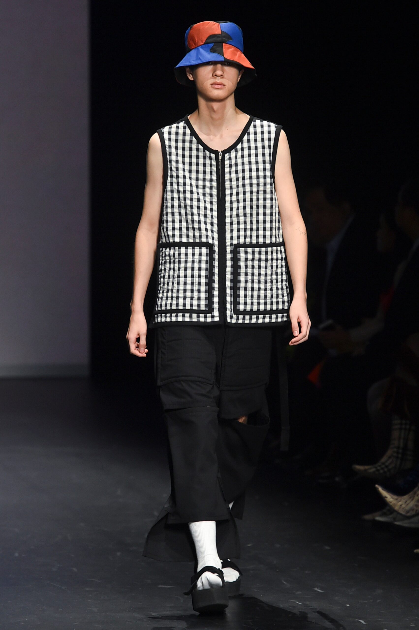 checked vest with relaxed pants