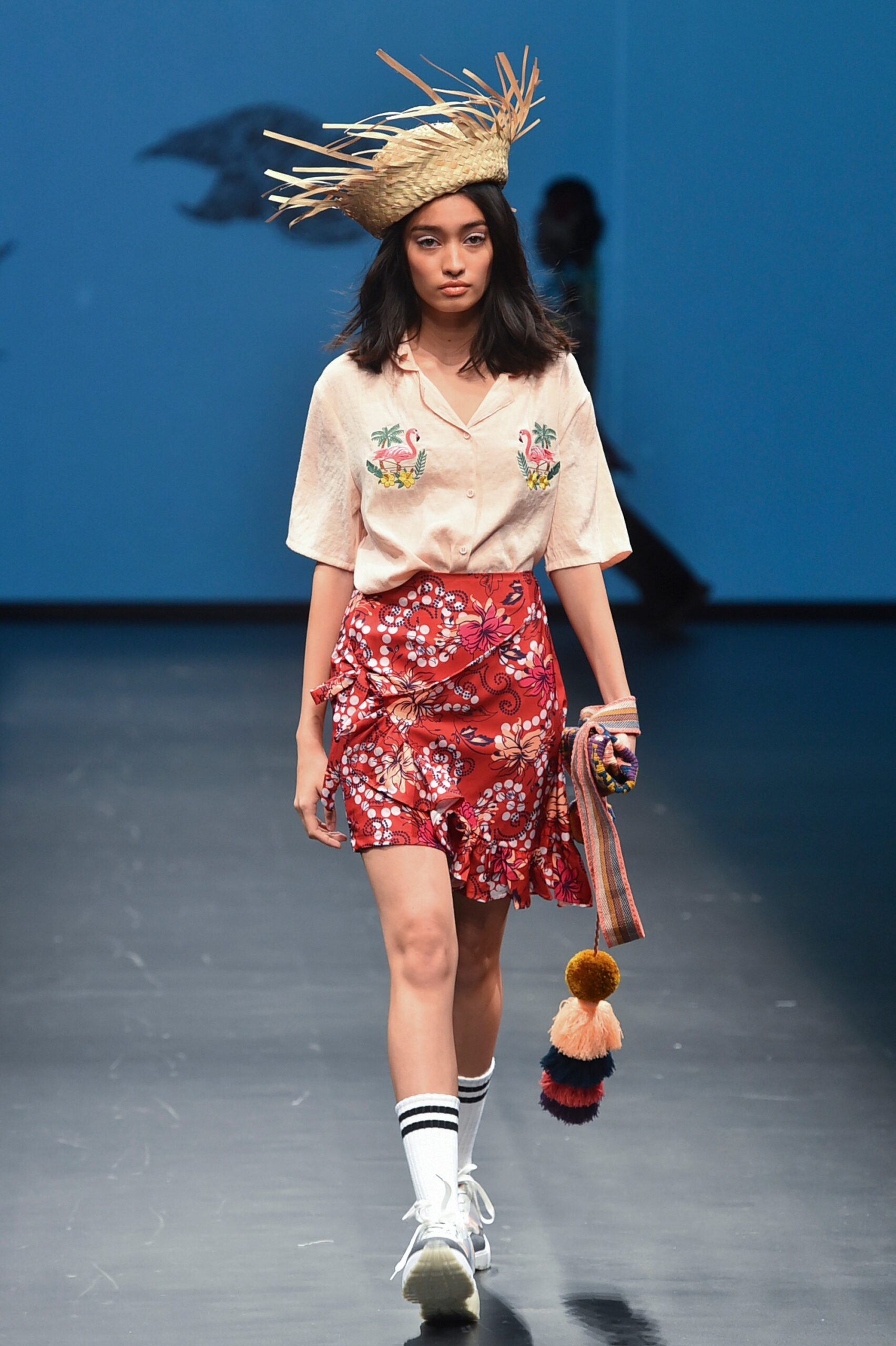 beige embroidered shirt and red flared skirt