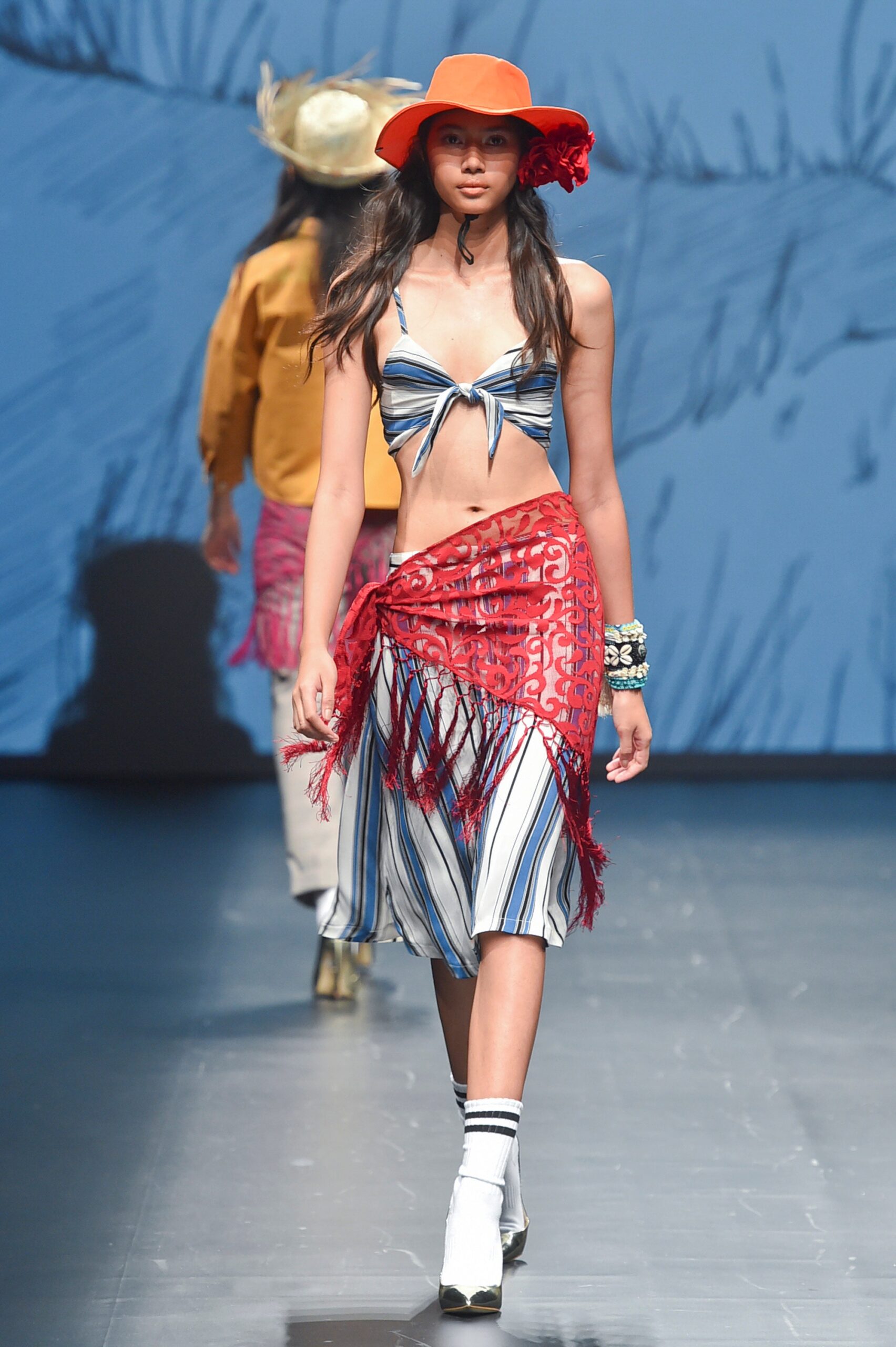blue and white striped top with red skirt