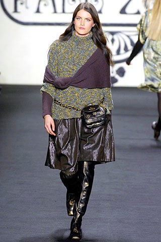 purple and green layered sweater with black leather skirt