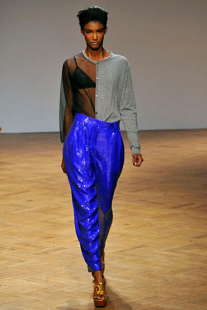 gray mesh top with blue pants