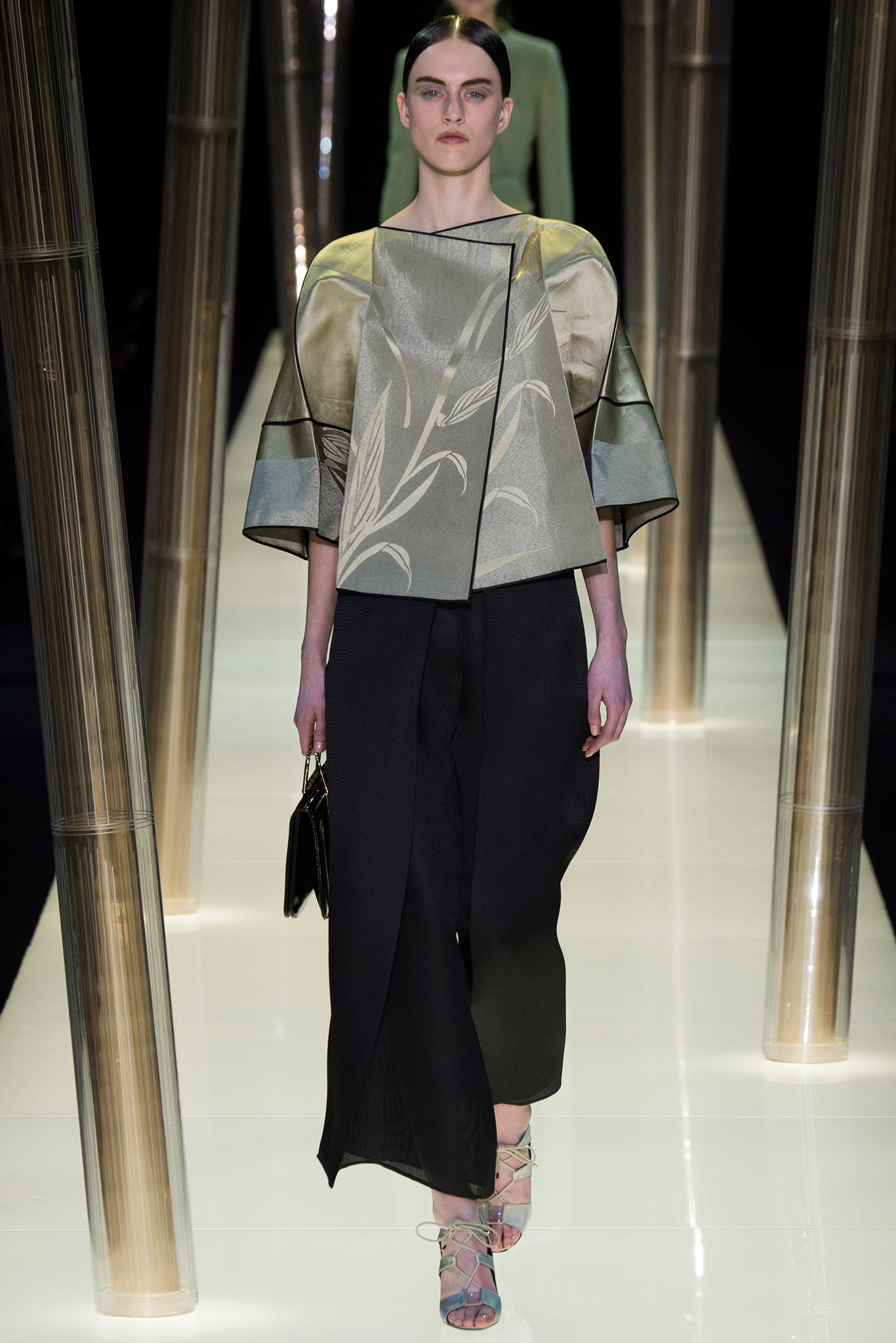beige embroidered top with black pants