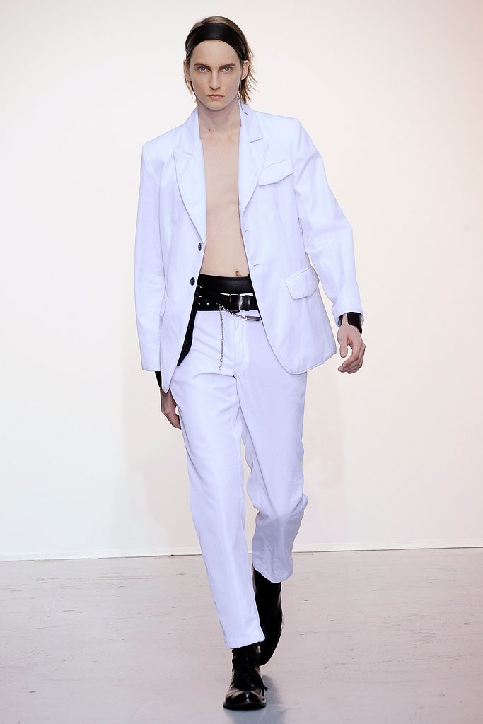 white tailored suit with black belt