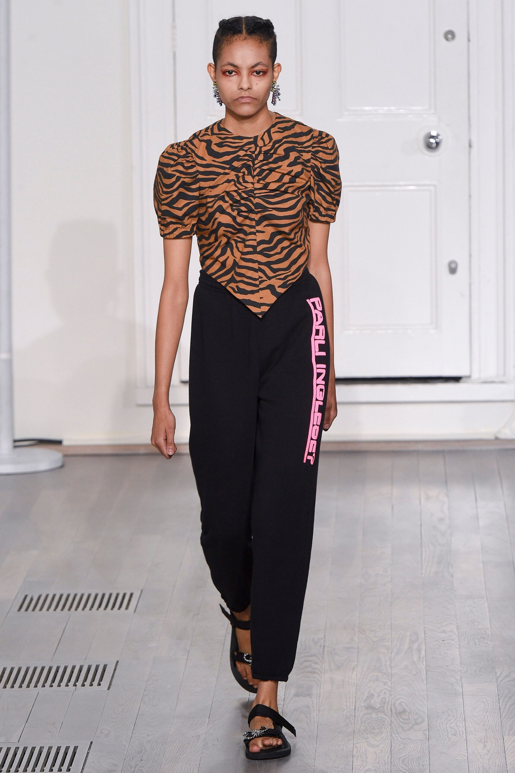 brown animal-print fitted top with black pants