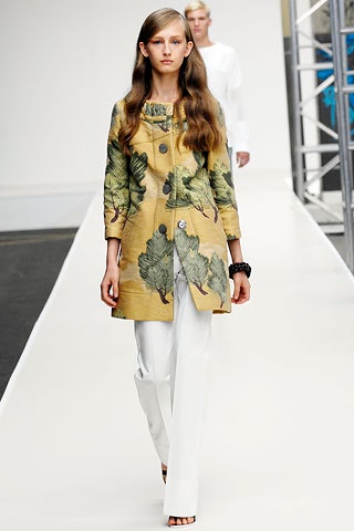 yellow printed coat with white pants